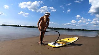 Big-Ass Blonde's Naked Walk on a Paddleboard