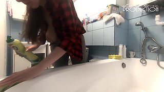 Lena's massive breasts on display while cleaning the bathtub