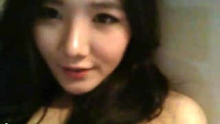 Korean camgirl with beautiful tits plays with her pussy