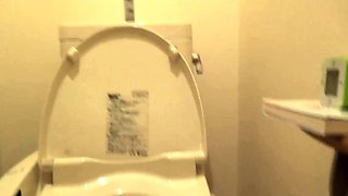 Asian teen pees in toilet