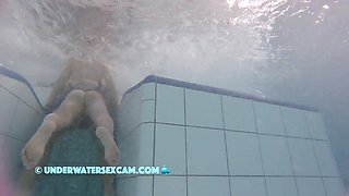 This Young Couple Plays Together Underwater In Front Of Many People