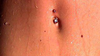 Young blonde splashes in the water