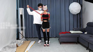 A Young, Beautiful, Slender, and Adorable Girlfriend, with Black Stockings, Red Strings, and Restraints