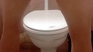 Hot Girl Slut Masterbation with Pink Vibrator in Toilet Mini Skirt