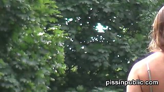 Watch these babes get a relieving park visit and get their shaved pussies up close