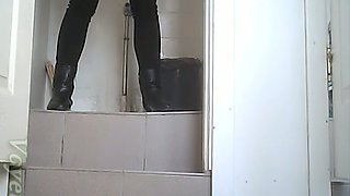 White amateur chick in high heel boots pisses in the toilet