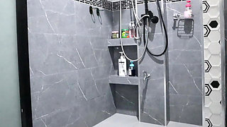 A Thai Woman Is Taking a Shower, Revealing Her Pink Nipples and Smooth, Soft Vagina While Applying Body Lotion