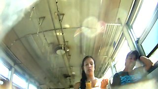 Upskirt video features a sexy young chick on a bus.