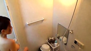 Massage whore in shower gives handjob in shower