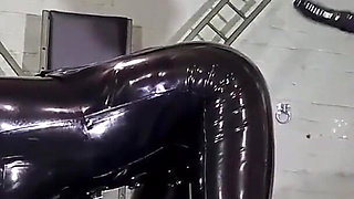 Latex Nurse inspects her gimp patient