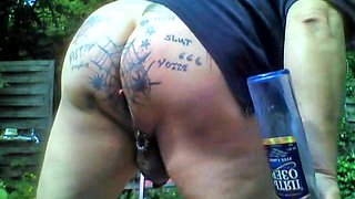 Tattooed XXl-Asshole in the garden