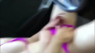 Horny babe masturbates in the car